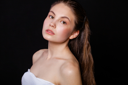 Close up Make up fashion model. Young beautiful brunette girl, on studio black wall backgroundの写真素材
