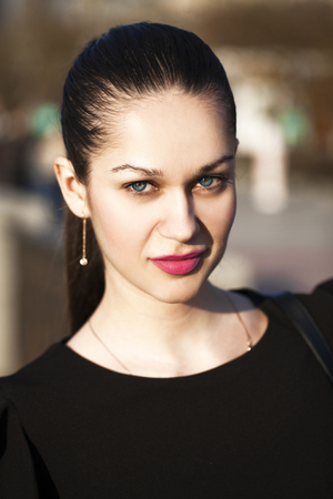 Close up, Portrait of a young beautiful brunette girl at sunset dayの写真素材