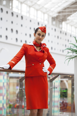 RUSSIA, MOSCOW: 28 JUNE 2019. Beautiful stewardess dressed in official red uniform of Aeroflot Airlines on airportのeditorial素材