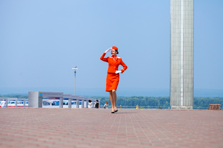 RUSSIA, SAMARA: 26 JULE 2019. Beautiful stewardess dressed in official red uniform of Aeroflot Airlines, Summer Samara outdoorsのeditorial素材