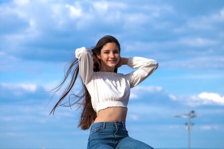 Young beautiful girl in blue jeans