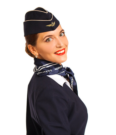 RUSSIA, MOSCOW: 21 SEPTEMBER 2019. Beautiful stewardess dressed in official blue uniform of Aeroflot Airlines - isolated on white backgroundのeditorial素材