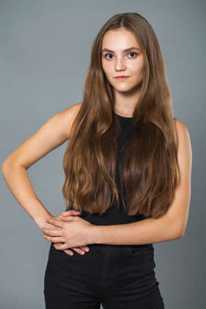 Portrait of a young beautiful brunette girl, indoorの写真素材