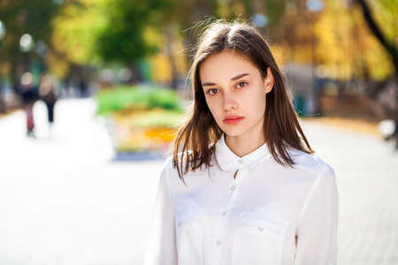 Portrait of a stylish model in a yellow coatの写真素材