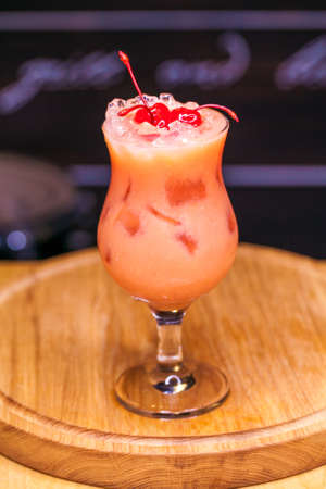 Alcoholic cocktail on wooden boardの写真素材