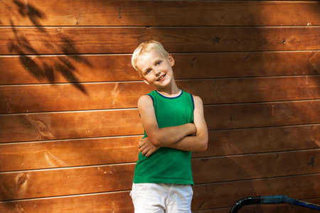 Close-up portrait of a little boy in a summer parkの写真素材