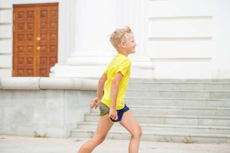 Close-up portrait of a little boy in a summer parkの写真素材