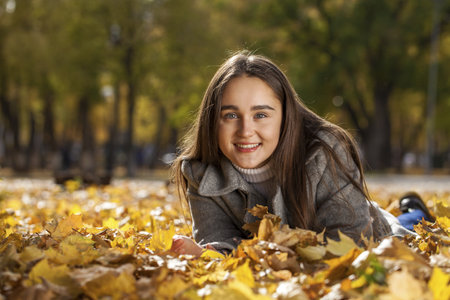 Full body portrait of a young beautiful brunette model, isolated on gray backgroundの写真素材