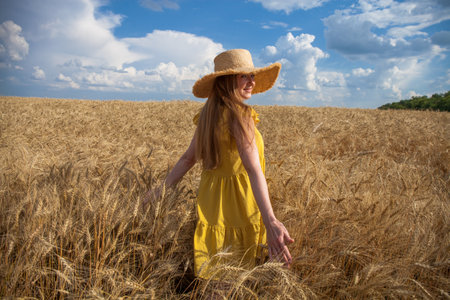 Portrait of a red-haired young woman in yellow dressの写真素材