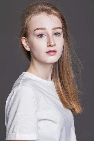 portrait of a young blonde model in wheat fieldの写真素材