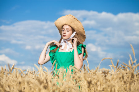 portrait of a young blonde model in wheat fieldの写真素材