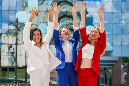 Full length portrait of four business women outdoorsの写真素材