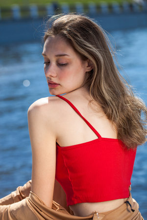 Close up portrait of a young beautiful girl, summer park outdoorの写真素材