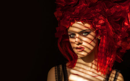 Make up beauty. Portrait of a young beautiful fashion model in dark studio