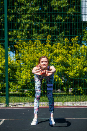 Fitness portrait young athletic woman doing gymnastics