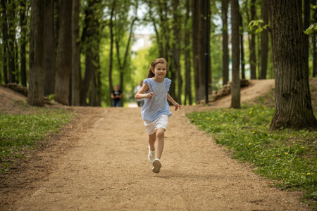 Portrait of a little blonde girl, summer outdoorの写真素材