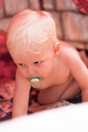 Two Year old baby boy in the bedroom