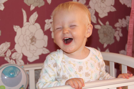 Year old baby boy in the bedroomの写真素材