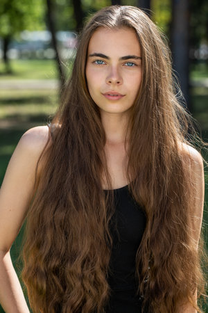 Close up portrait of a young beautiful woman, summer outdoorの写真素材