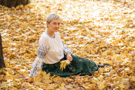 Autumn portrait of a young beautiful blonde womanの写真素材