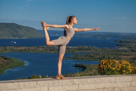 Fitness portrait young athletic woman doing gymnasticsの写真素材