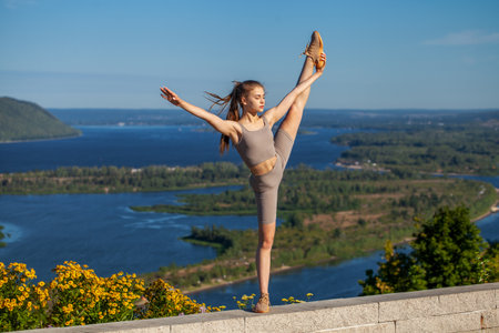 Fitness portrait young athletic woman doing gymnasticsの写真素材