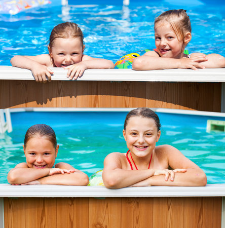 Two Happy sisters in bikini swimming poolの写真素材