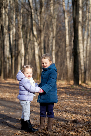 Couple sisters in autumn parkの写真素材