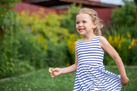 Happy portrait of a young beautiful little girlの写真素材