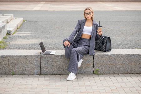 Business woman, portrait of a blonde girl in a pantsuitの写真素材