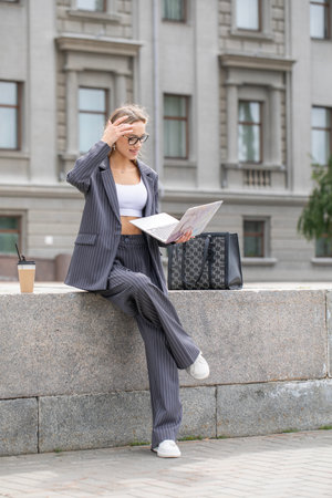 Business woman, portrait of a blonde girl in a pantsuitの写真素材