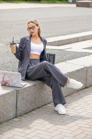 Business woman, portrait of a blonde girl in a pantsuitの写真素材