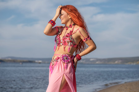Portrait of a red-haired woman in an oriental dance costumeの写真素材