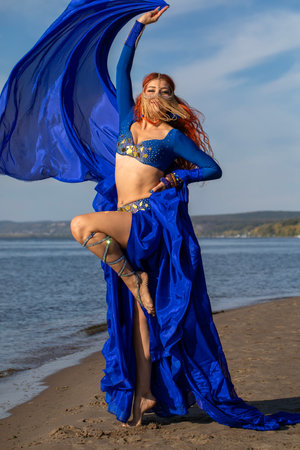 Portrait of a red-haired woman in an oriental dance costumeの写真素材