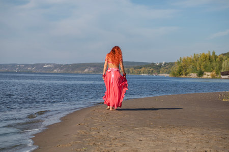 Portrait of a red-haired woman in an oriental dance costumeの写真素材