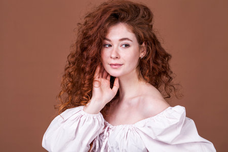 Studio portrait of a red-haired girl