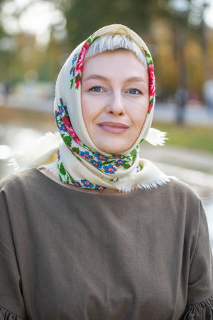 Russian beauty - young beautiful girl in a traditional headscarfの写真素材