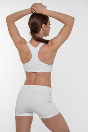 Fitness woman. Portrait of a young athletic brunette modelの写真素材