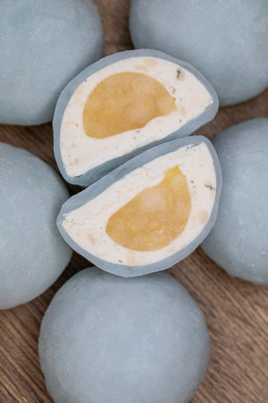 Mochi - sweet Japanese dessert. Whole and pieces of dessert on a wooden boardの写真素材