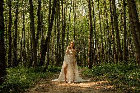 Portrait of a young beautiful girl in the image of a forest fairyの写真素材
