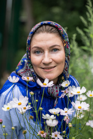 Russian beauty. Portrait of a middle-aged woman in a headscarf