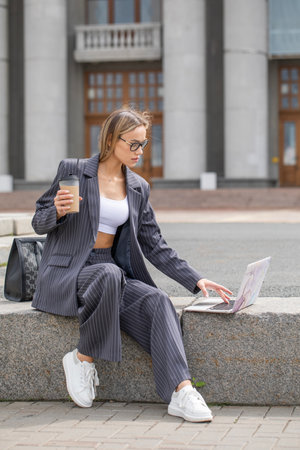 Business woman, portrait of a blonde girl in a pantsuitの写真素材