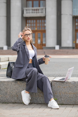 Business woman, portrait of a blonde girl in a pantsuitの写真素材