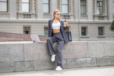 Business woman, portrait of a blonde girl in a pantsuitの写真素材