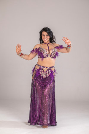 Portrait of a young attractive brunette woman in oriental dance costumeの写真素材