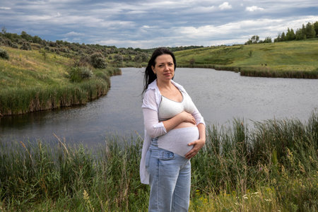 portrait of a pregnant woman in natureの写真素材