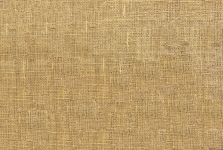 raw organic fabric sackcloth canvas woven textile backdrop の写真素材