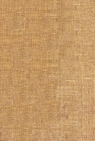 raw organic fabric sackcloth canvas woven textile backdrop の写真素材