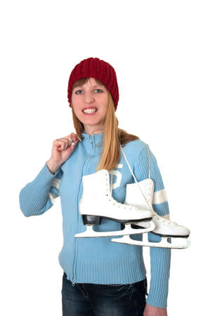 ice skating happy girl taking her ice skates in front of white backdropの写真素材