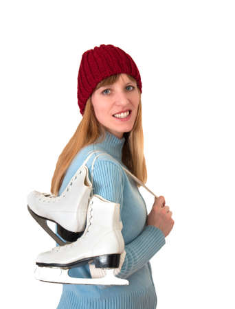 happy girl prepared for ice skating in front of white backdropの写真素材